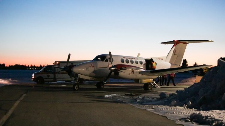 Emergency vehicles stand-by near the site of a deadly accident in rural Canada 