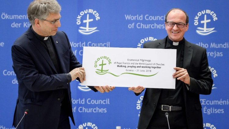WCC General Secretary Rev. Olav Fykse Tveit and Fr Andrzej Choromanski from the Vatican's Council for Christian Unity hold the logo for the June 21st Ecumenical Pilgrimage
