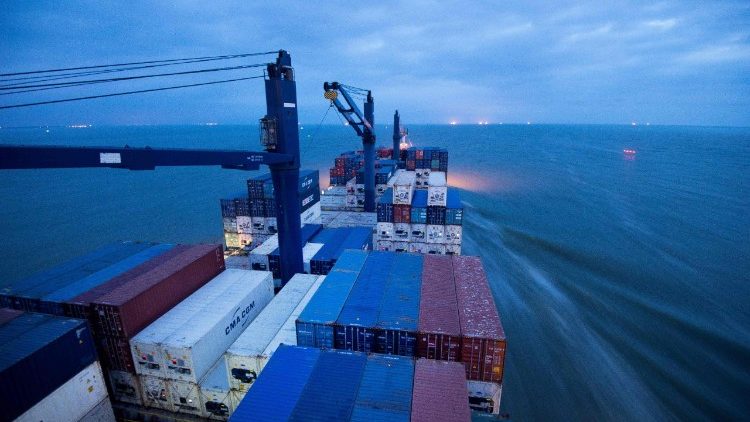 A container ship plies the sea