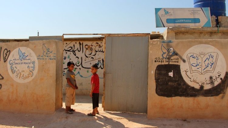 Displaced Syrian children on their first day at a makeshift school, September 2018