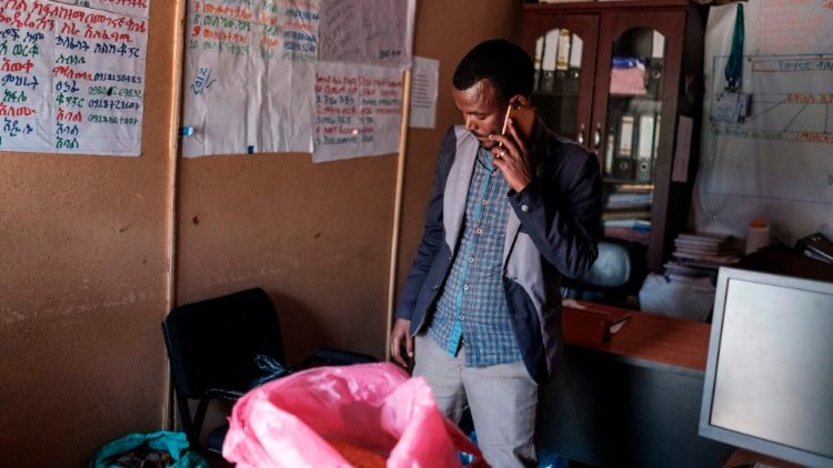 A local official in the Ethiopian city of Gondar checks bags of food donations