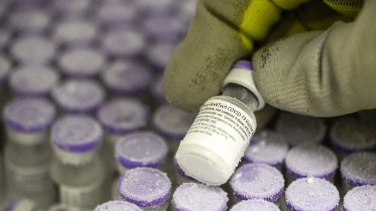 A pharmacist in France holds a phial of the undiluted Pfizer-BioNTech vaccine for Covid-19