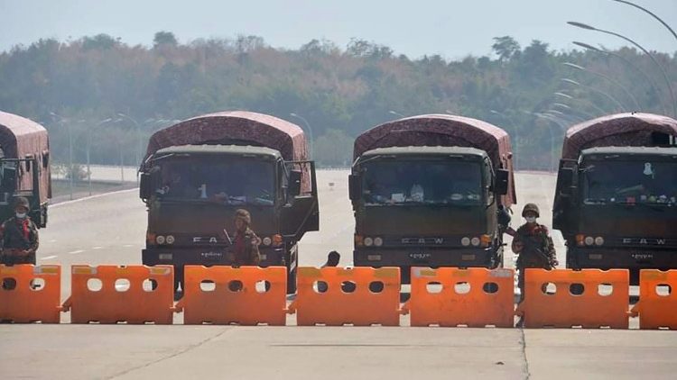 Soldiers blockade a road leading to Myanmar's parliament in Nay Pyi Taw