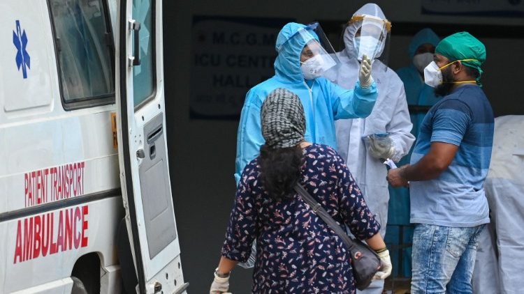 Health workers in India wearing PPE