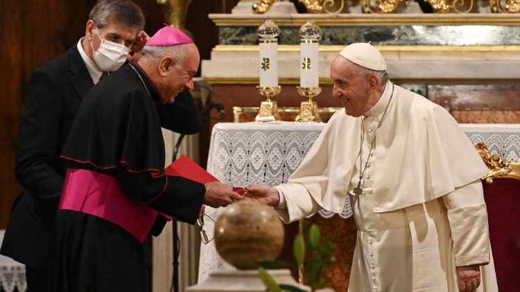 Pope Francis greets participants at a meeting with Catholic clergy and laypeople in Athens' Catholic Cathedral