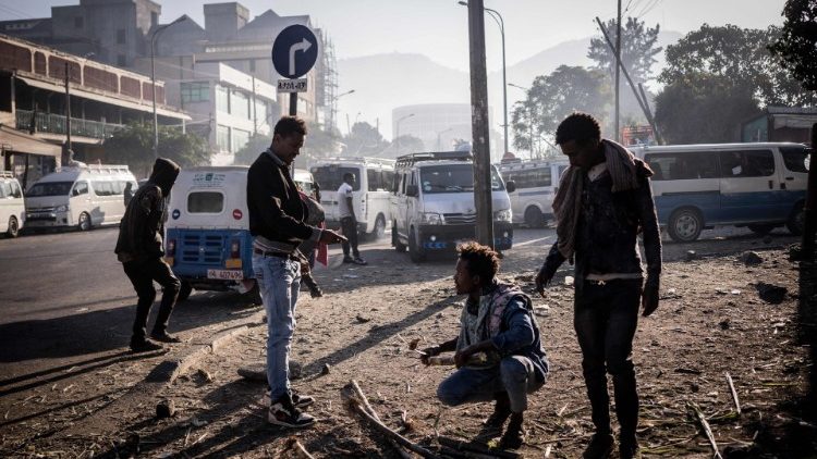 People trade wood in the streets of Kombolcha, Ethiopia