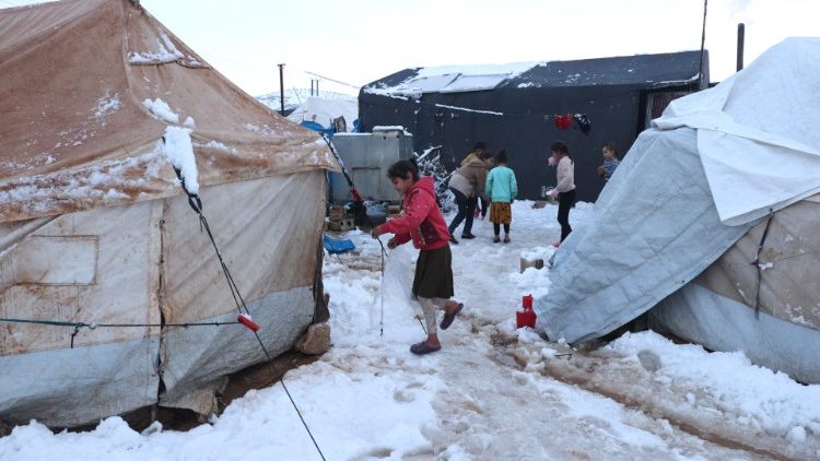 Children in the snow at a camp for internally displaced Syrians near Afrin city.