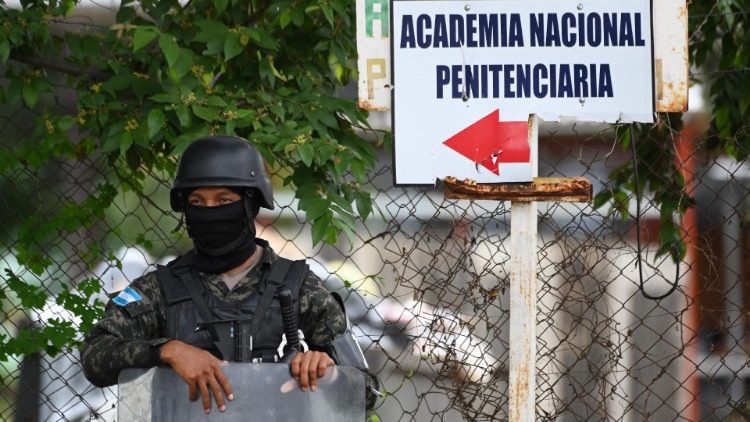 A military police officer stands guard outside the women's prison in Tamara