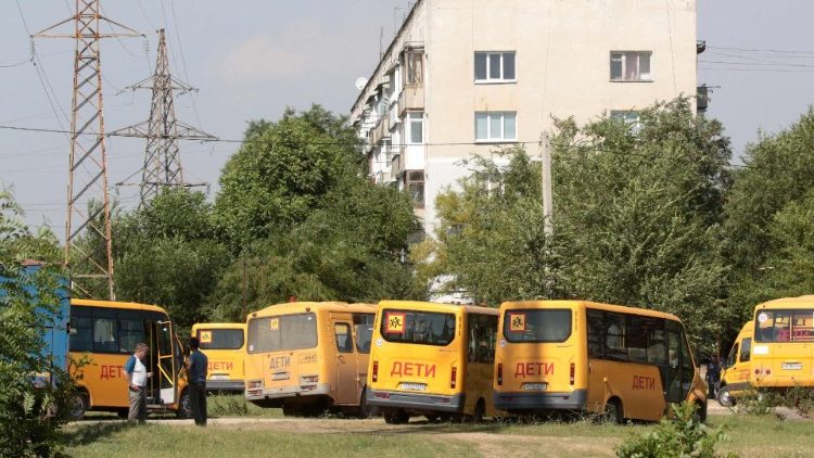 Buses stand ready to evacuate civilians near Simferopol on the Crimean peninsula 
