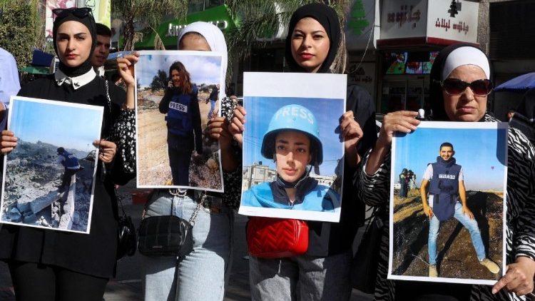 Palestinians rally in the West Bank city of Nablus in support of journalists working in the Gaza Strip