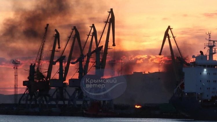 Smoke rises above a damaged Russian warship in Crimea