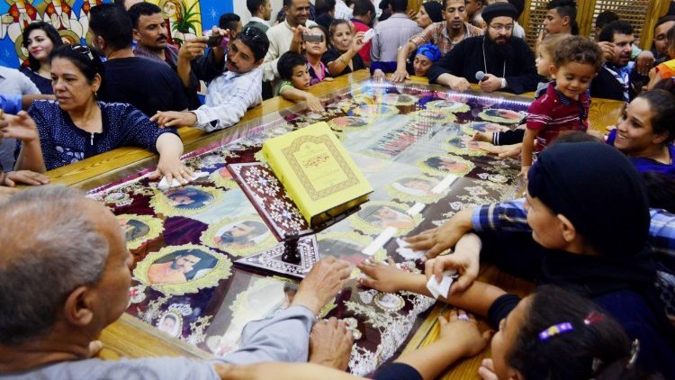 File photo: Relatives of the murdered Christians mourn their loss