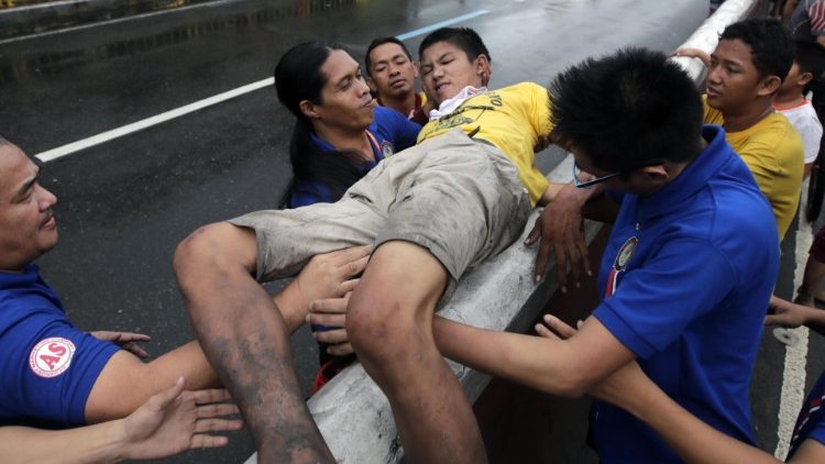 Devotees converge around the procession of the Black Nazarene on New Years Eve