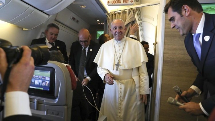 Pope Francis speaks to journalists aboard the papal plane