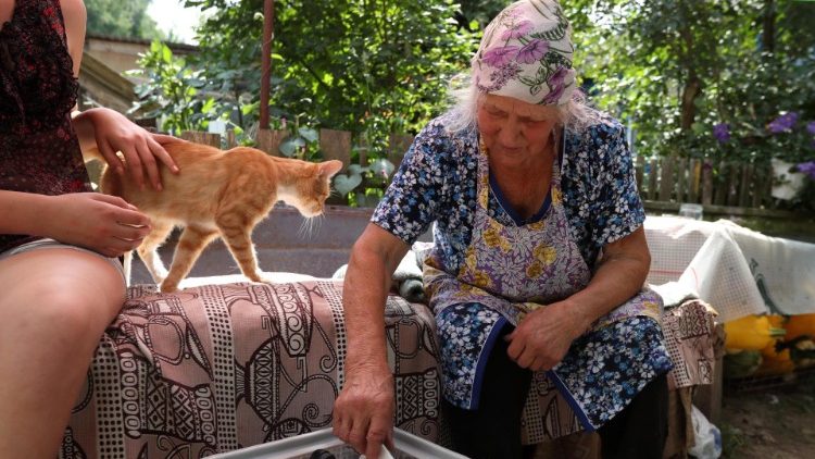 A lady casts her ballot paper in a mobile ballot box during parliamentary election