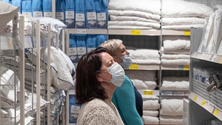 Shoppers wearing face masks in public