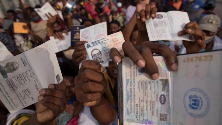 Hundreds of Haitians gather in front of the US embassy in the hope they will be granted a visa to leave their country due to the uncertainty