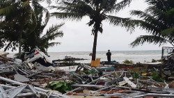 a-man-stands-among-ruins-after-a-tsunami-hit--1545556130443.JPG