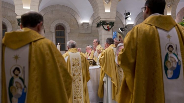 Acting Latin Patriarch of Jerusalem Pierbattista Pizzaballa leads a Christmas midnight mass at Saint Catherine's Church, in the Church of the Nativity, in Bethlehem, in the Israeli-occupied West Bank