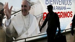 a-passenger-walks-past-a-poster-of-pope-franc-1548119635408.JPG