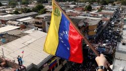 the-venezuela-flag-is-seen-as-supporters-of-v-1553310536328.JPG