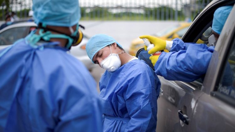 A hospital worker is sprayed with disinfectant at Guasmo Sur General Hospital after Ecuador reported new cases of coronavirus disease (COVID-19), in Guayaquil