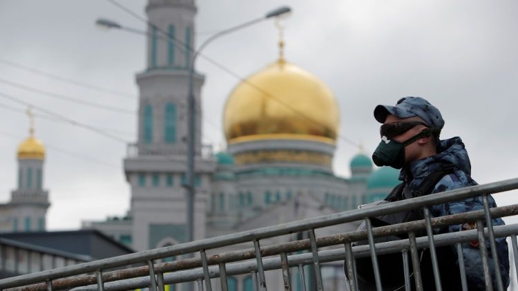 A law enforcement officer stands guard outside a closed Moscow mosque