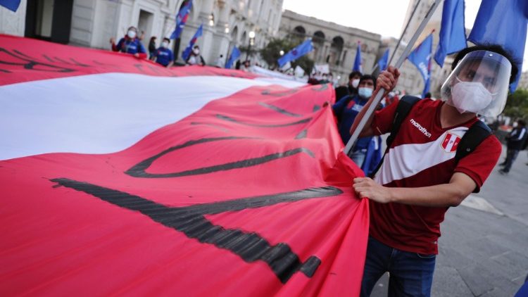 Demonstrators participate in a march asking for changes in the constitution, in Lima