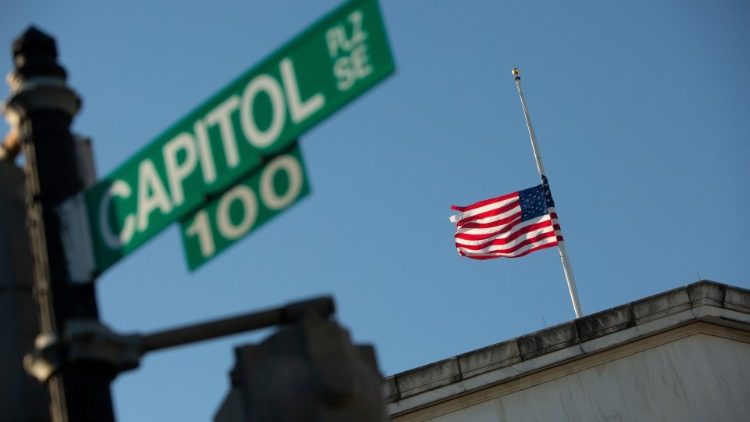 An American flag flies at half-mast at the Longworth House Office Building in Washington