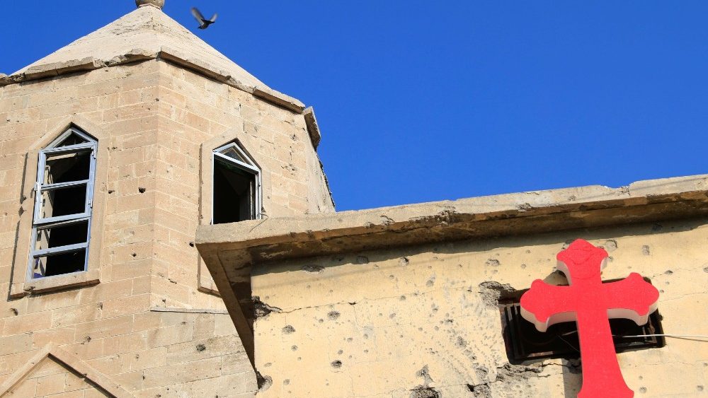 A cross is pictured at the wall of a church in the old city of Mosul