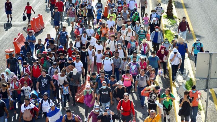 Central American and Caribbean migrants walk in a caravan in Mexico's Chiapas State