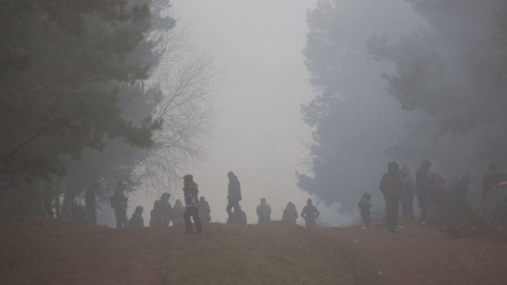 Migrants gather on the Belarusian-Polish border