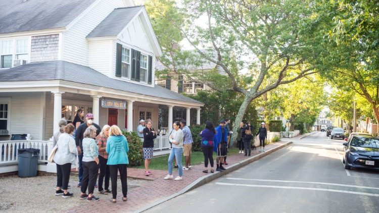 Migrants gather after been flown from Texas at Edgartown, Massachusetts