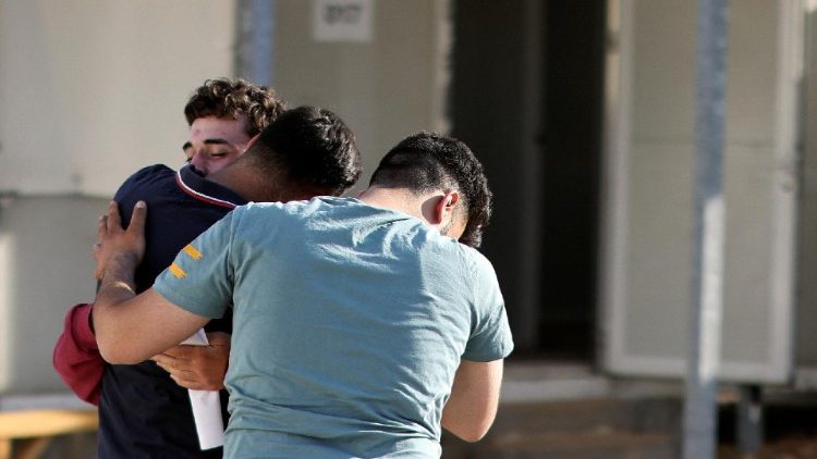 Survivors of a deadly migrant shipwreck reunite with relatives and friends in Malakasa camp