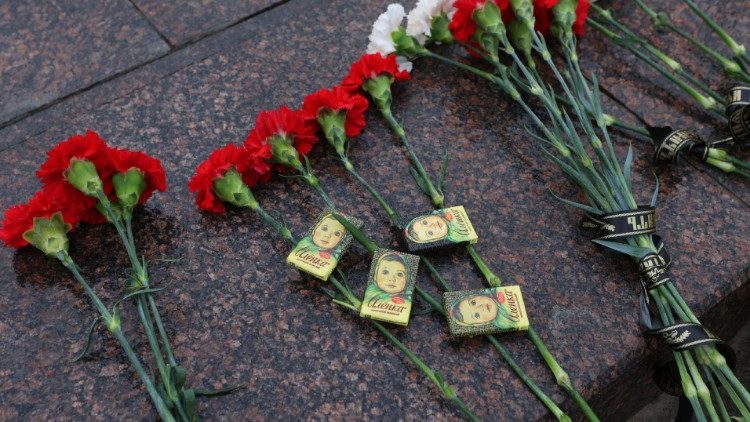 Flowers and chocolate bars at a makeshift memorial to the victims of the shelling in Belogorod