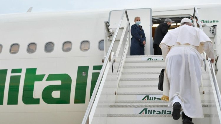 Pope Francis boards the papal plane at Rome's Fiumicino airport