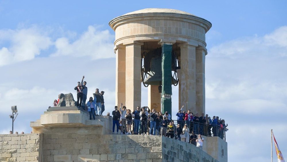 Onlookers as Pope Francis travels by boat from Malta to the nearby island Port of Gozo