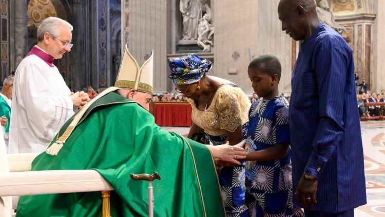 Pope Francis with a young man and his grandparents