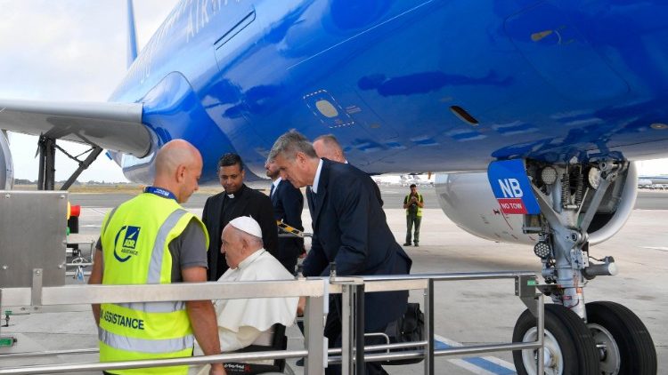 Pope Francis boards the papal plane at Rome's Fiumicino Airport