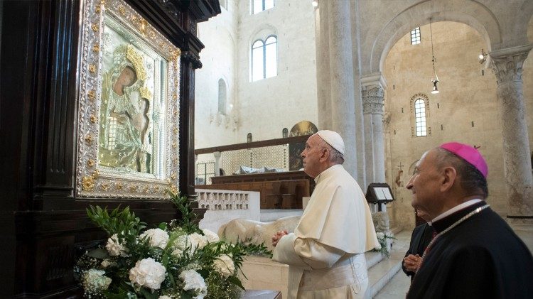 Pope Francis prays before an icon of Mary in Bari's Cathedral on Saturday