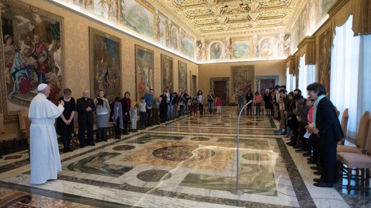 Pope Francis meets with young Romanians at a private audience in the Vatican