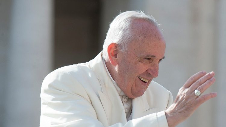 Pope Francis waving to crowds at his general audience