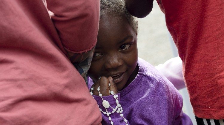 File picture of a child waiting for Pope Francis on his visit to Africa in 2015