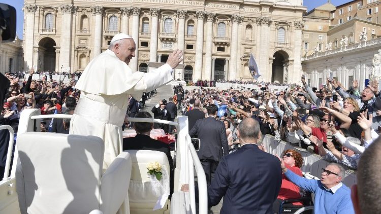 Pope Francis greets pilgrims gathered for the General Audience