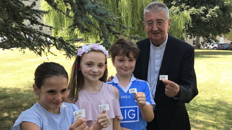 Archbishop Diarmuid Martin unveiling World Meeting of Families commemorative stamps issued by An Post