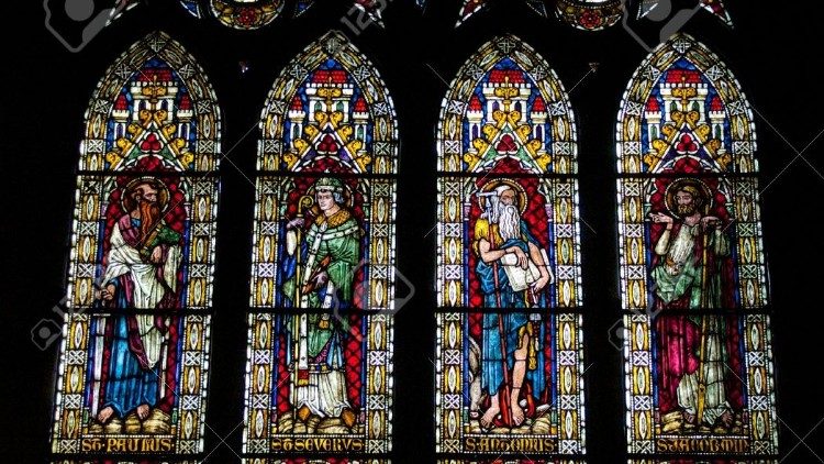 Stained glass windows portraying 4 saints