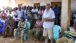 Padre Gazzera con la popolazione di Bozoum.jpg