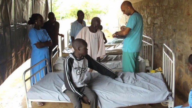 Tom Catena with patients at the Nuba Mountains Hospital.  Photo credit: Sudan Relief Fund