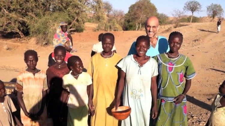 Tom Catena with local villagers. Photo credit: Sudan Relief Fund