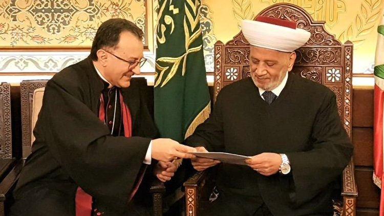 Apostolic Nuncio, Archbishop Joseph Spiteri (L) and the Grand Mufti of Lebanon, Sheikh Abdul Latif Derian.